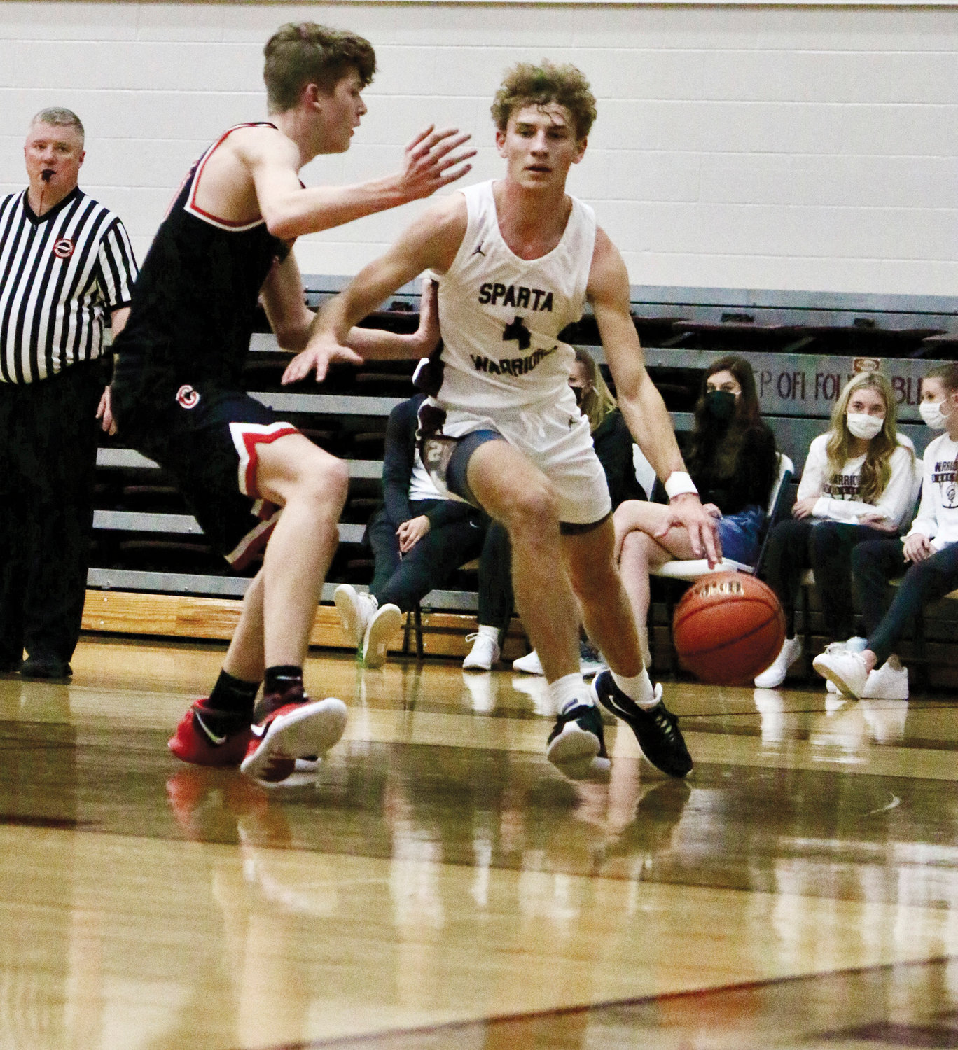 Tanner Paul drives to the basket in Friday night’s game against Coffee County. Paul finished with eight points, seven assists, and 10 rebounds.